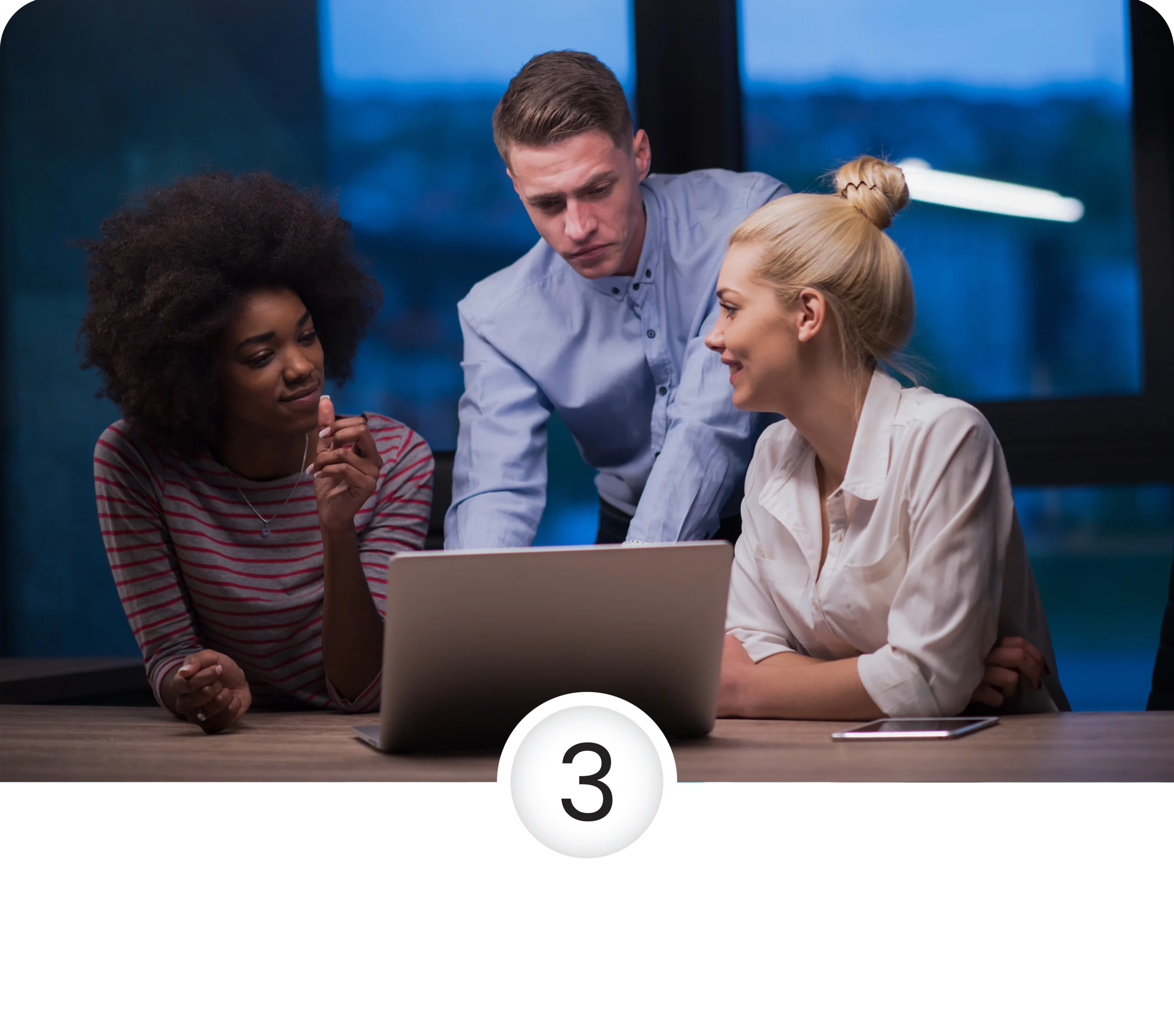 three people infront of a laptop