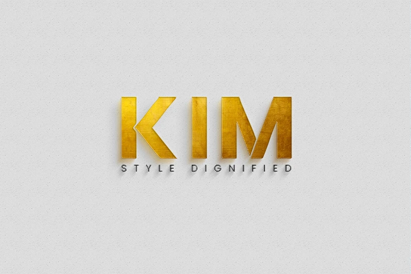Golden coloured KIM solid type font branding in a gray background